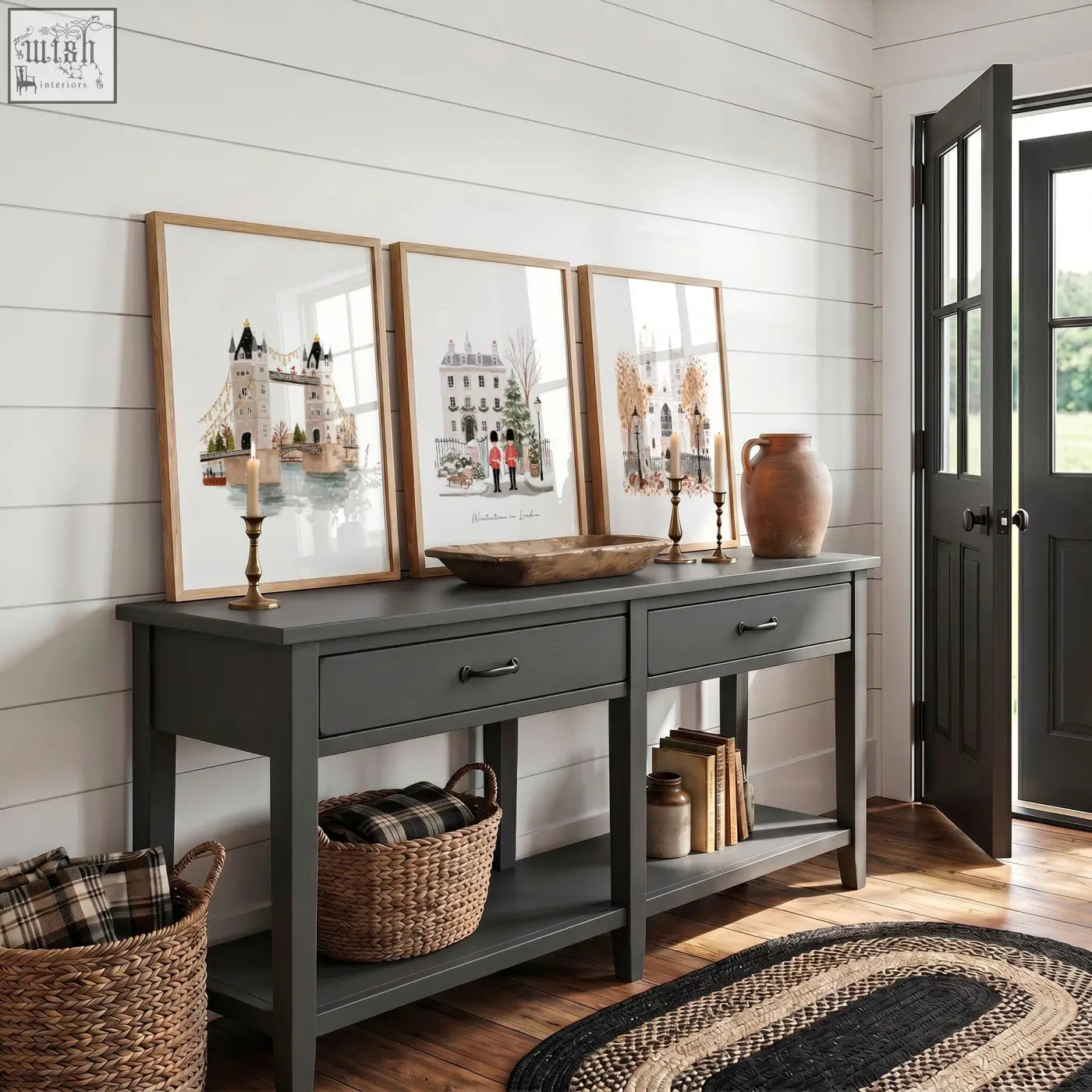 Dark gray console table with rustic wooden top and black metal handles paired with vintage travel posters art set of 3