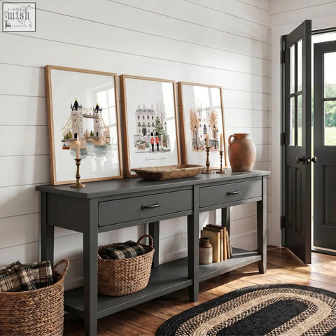 Dark gray console table with rustic wooden top and black metal handles paired with vintage travel posters art set of 3