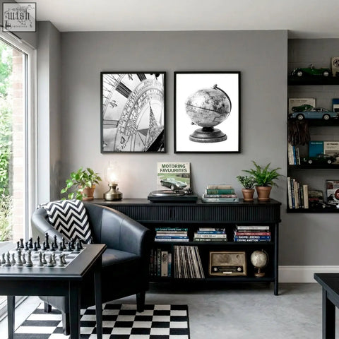 Black leather armchair with bold black and white chevron pillow next to vintage world map canvas for games room decor
