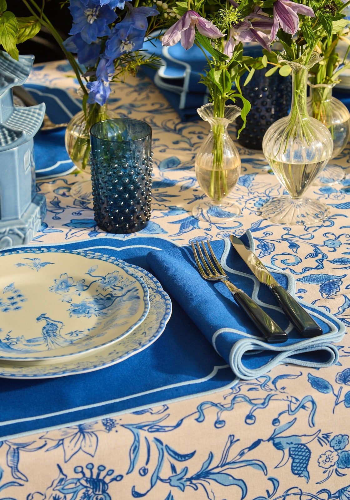 Blue and cream patterned tablecloth with intricate floral designs complements virginia blue and white dessert plates set of 4