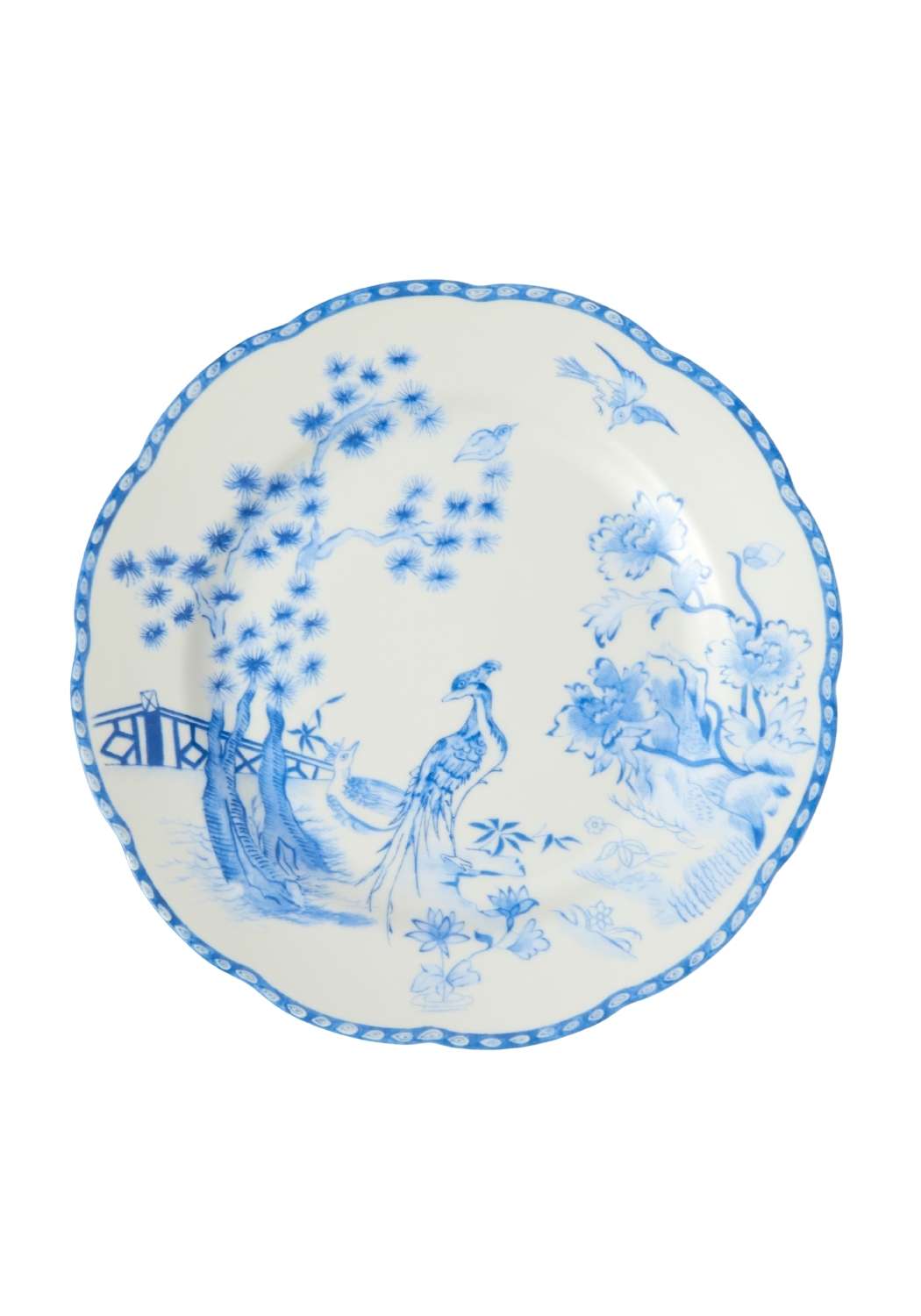 A delicate white porcelain dessert plate with scalloped edges featuring blue peacocks and garden scenes set of 4