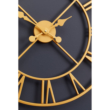 Vitus gold finish wall clock with gold-toned metal, minimalist geometric design, and roman numerals finish wall clock