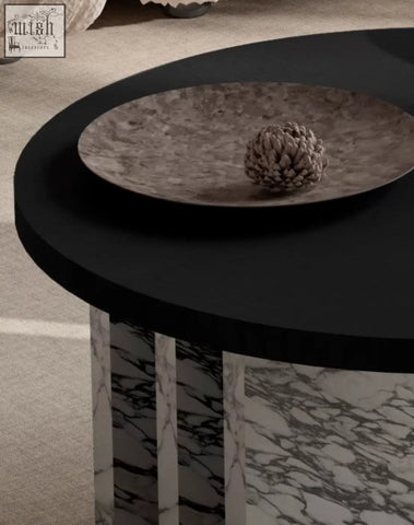 Vivien coffee table set featuring a black circular wood coffee table with marble patterned legs and a metallic plate
