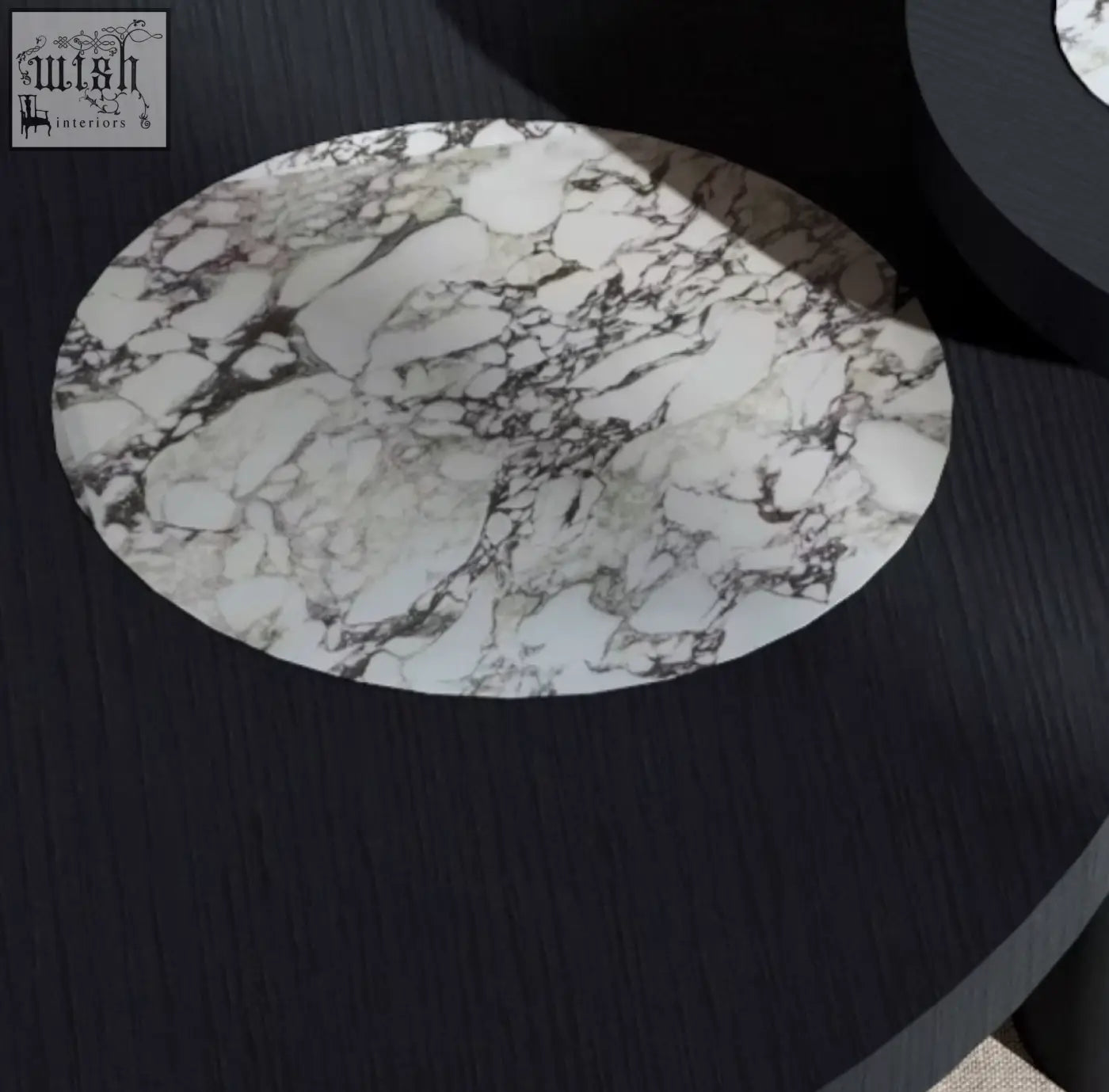 Vivien coffee table set features a circular white marble-patterned placemat with black veining on a wood coffee table
