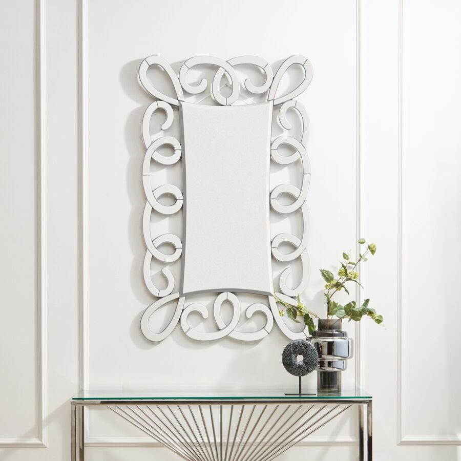 Vivienne black and silver scroll design wall mirror with an ornate silver scroll design frame and intricate swirling patterns