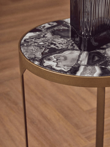 Vizzini round agate side table with sleek black and white round agate top and antique brass metal legs