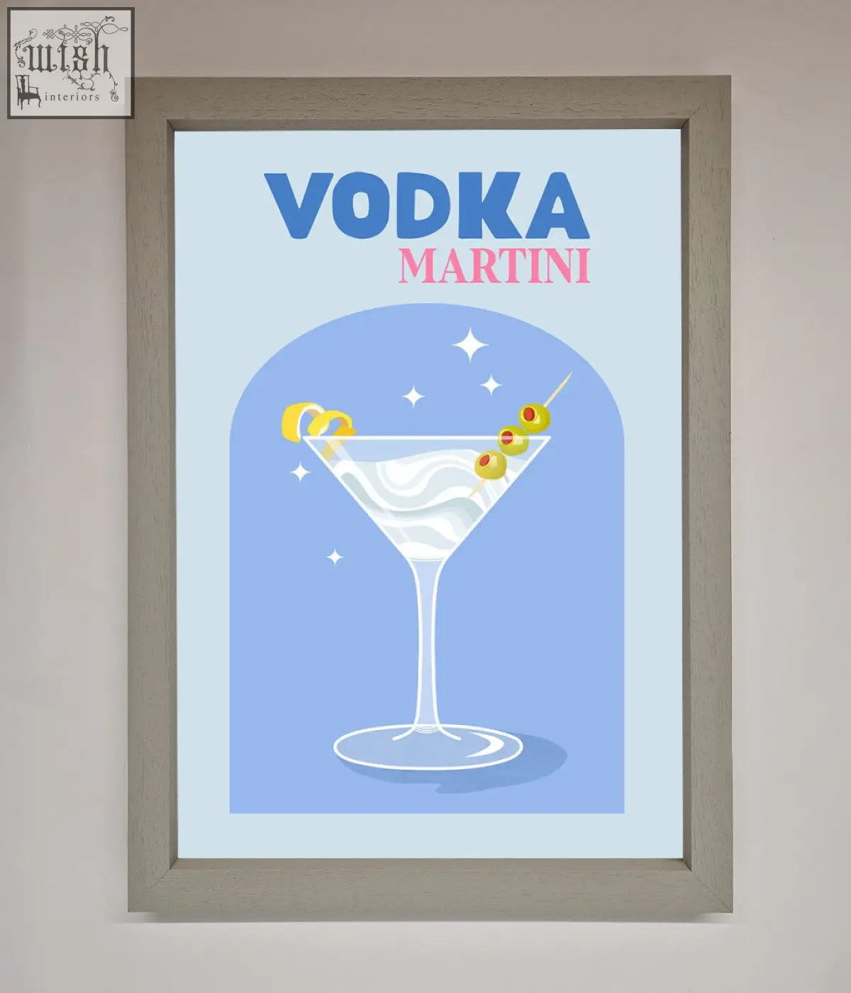 A vodka martini framed wall art featuring a classic martini glass with green olives and lemon twists on blue background