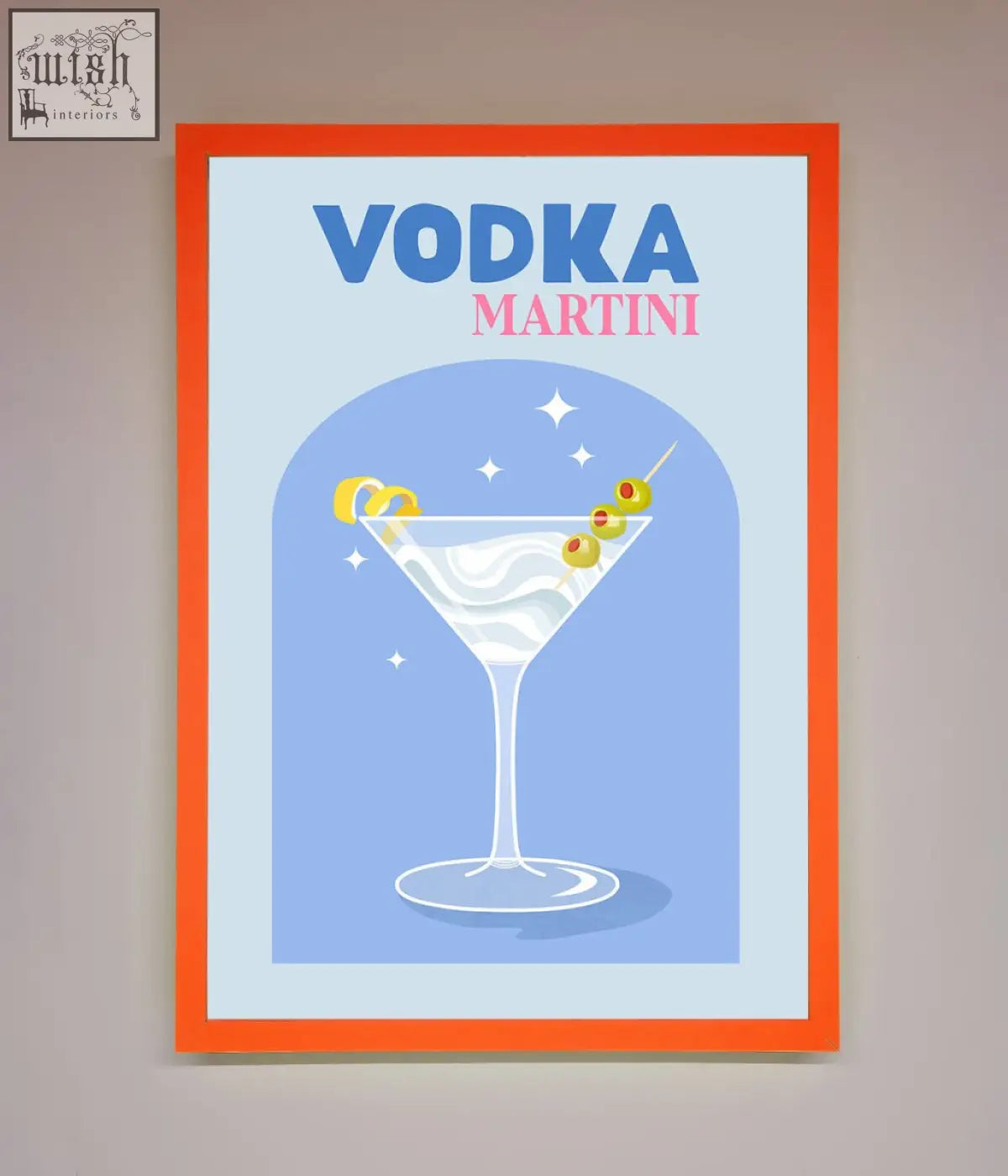 A vibrant orange-framed vodka martini framed wall art featuring a stylized martini glass with olives and lemon twist