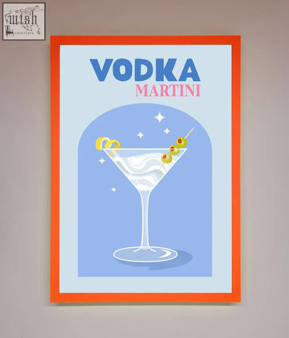 A vibrant orange-framed vodka martini framed wall art featuring a stylized martini glass with olives and lemon twist