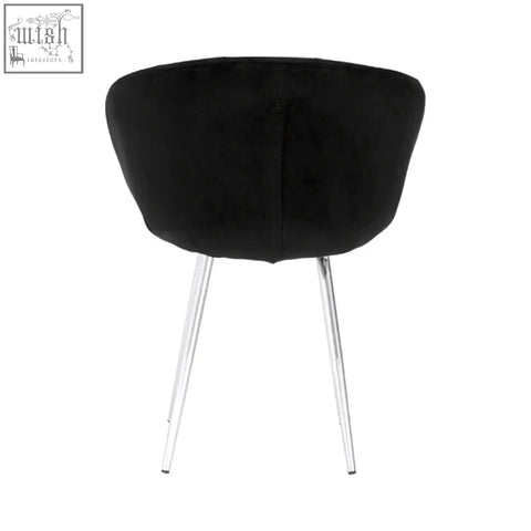 Vogue black and silver velvet chair featuring a black velvet seat with chrome legs for stylish seating