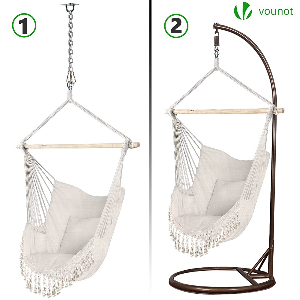 White macrame hammock swing chair with wooden support and fringe detailing for indoor or outdoor use