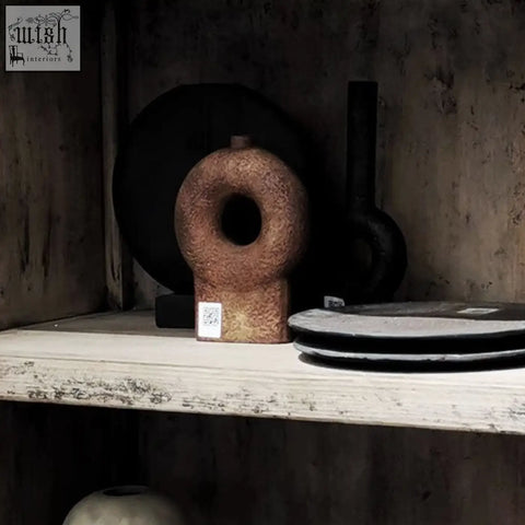 Rustic textured terracotta ring-shaped wabi ceramic vase with central hole and tapered base perfect for decor