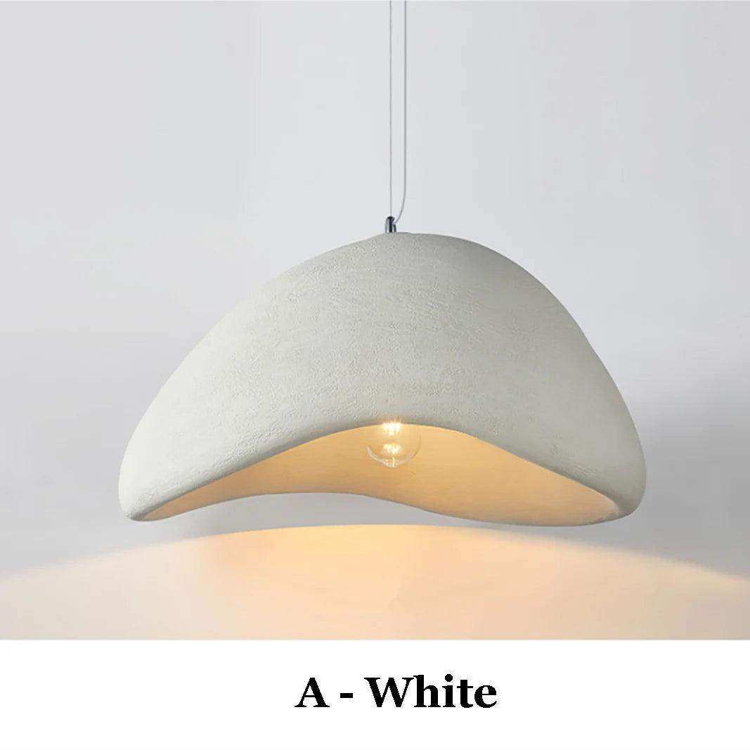 White textured concrete wabi sabi pendant light with warm glow perfect for ambient lighting in cozy spaces