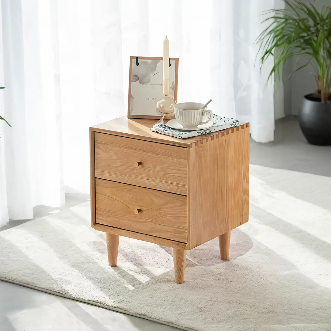 Light oak wood waktravel bedside table with two drawers and tapered legs made of solid wood for bedroom use