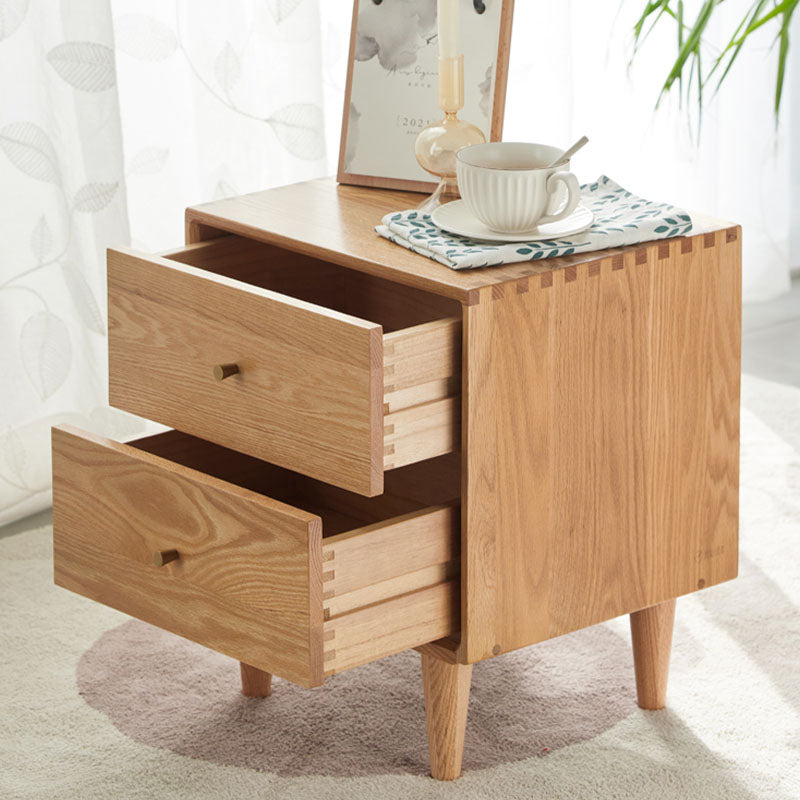 Light oak solid wood waktravel bedside table with two drawers and visible dovetail joints for bedroom use