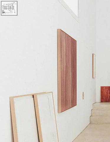 A tall rectangular wooden walburga wall art with reddish-brown finish and visible grain as a wall art background