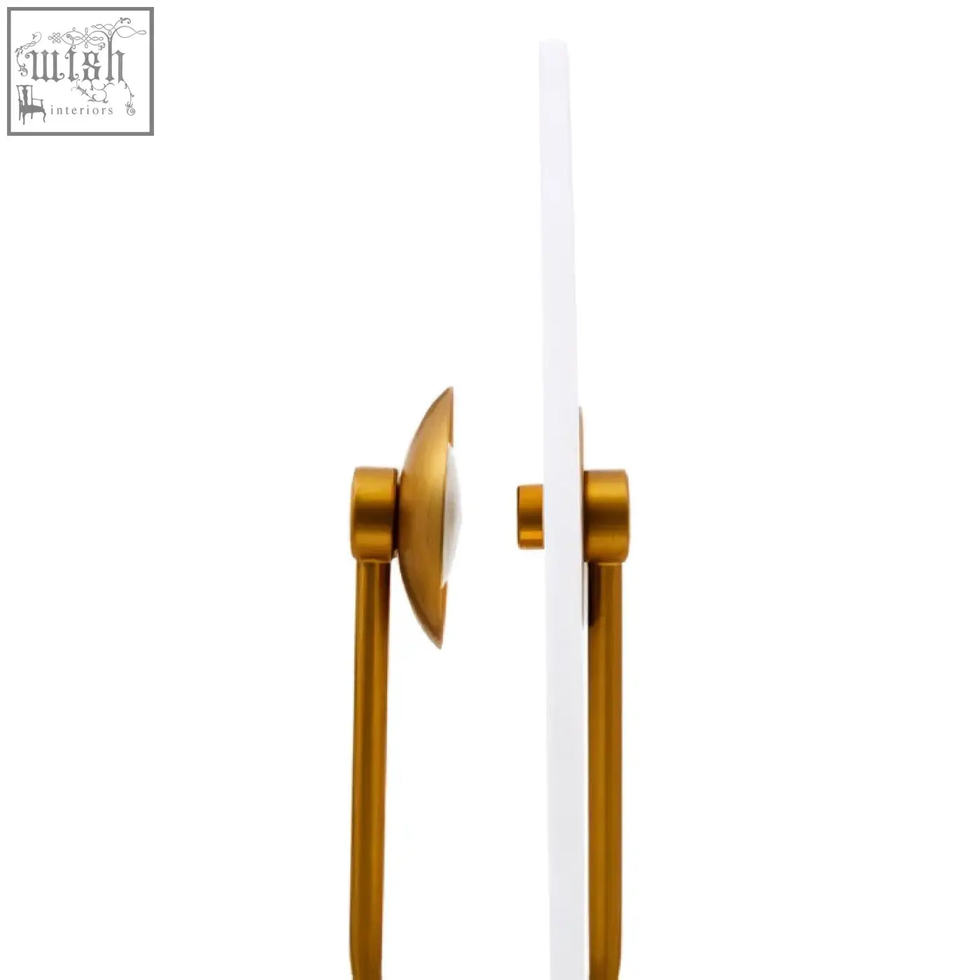 Gold-colored metal door handle with sleek circular pull plate on the waldorf marble table lamp base
