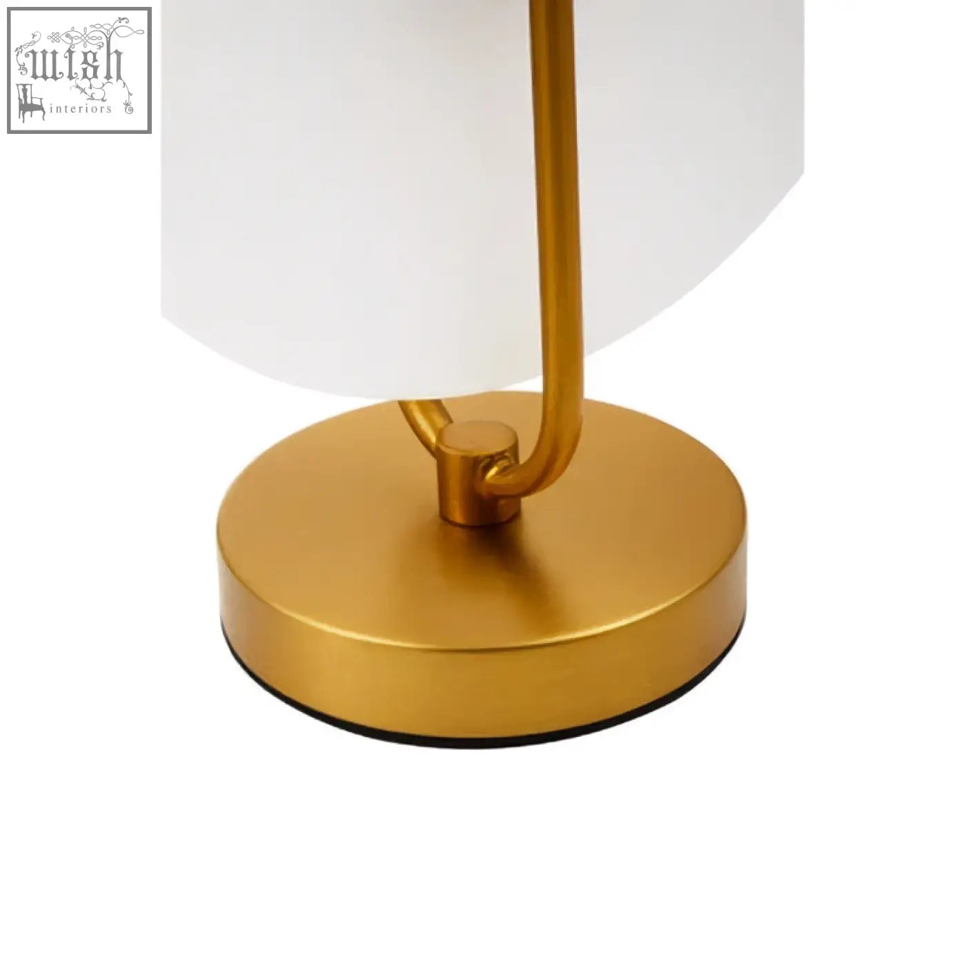 Gold finish table lamp with sleek curved stem and round base on a white marble table lamp base