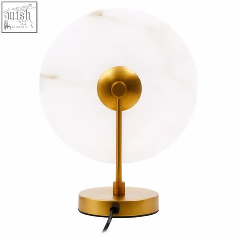 Gold-toned marble table lamp with a circular glass shade and sleek metallic base perfect for elegant decor