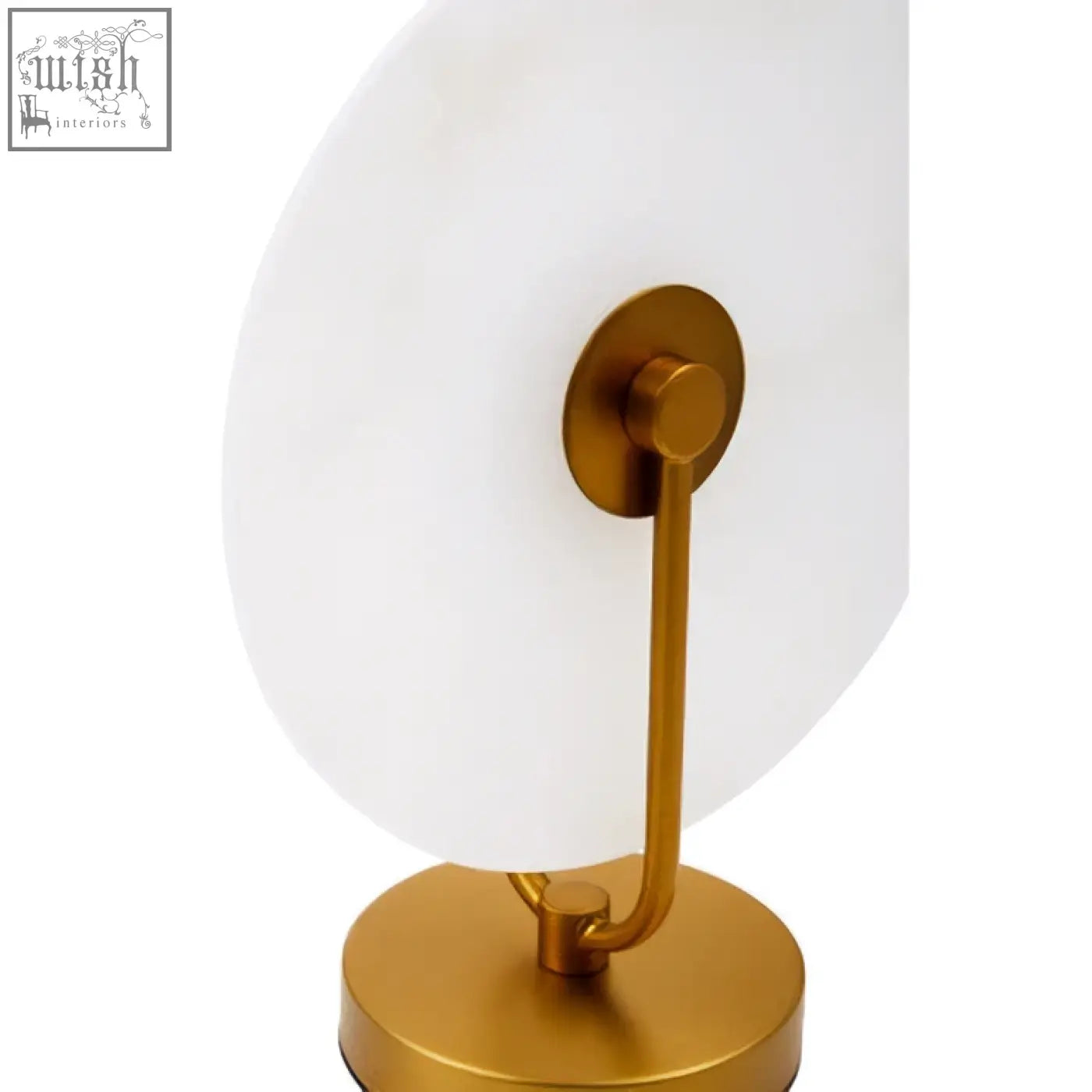 Gold-toned vanity mirror with a sleek white glass surface and minimalist frame paired with a marble table lamp