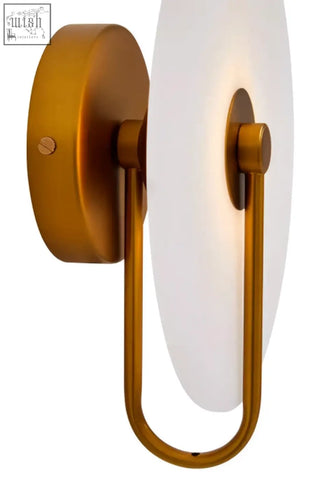 Gold-finished wall sconce with circular frosted glass shade and minimalist frame for white marble wall lighting