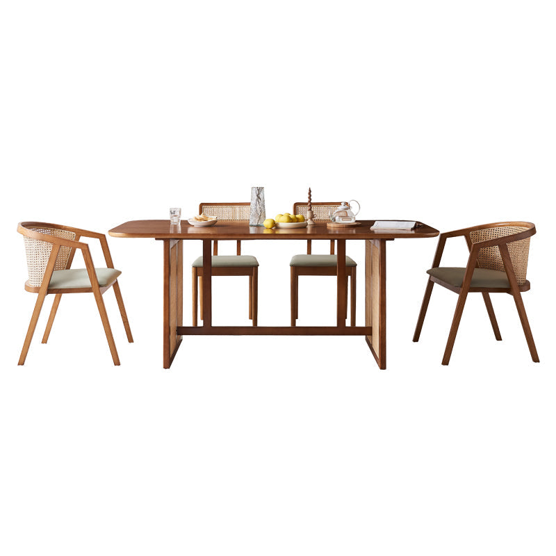 Warm-toned wooden waldron rattan dining table set with sleek modern design and integrated side extensions