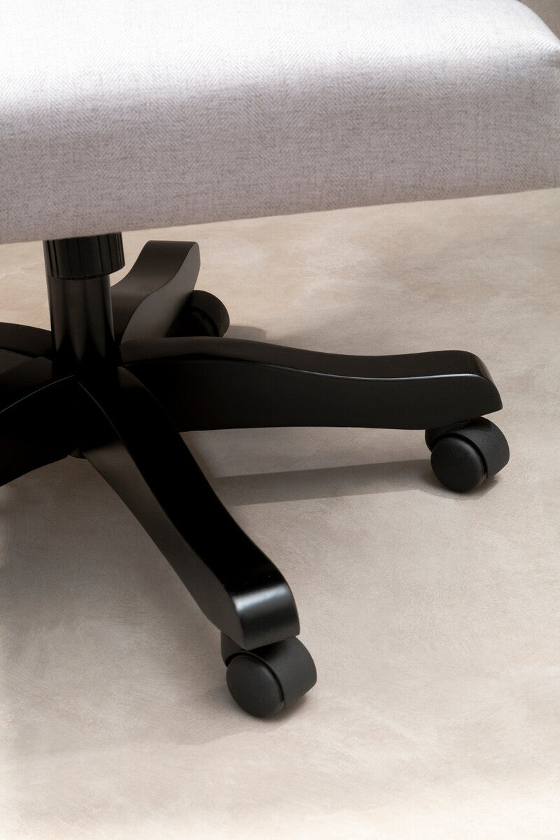 Black five-star base with casters under light grey upholstered walford grey home office chair for home office use