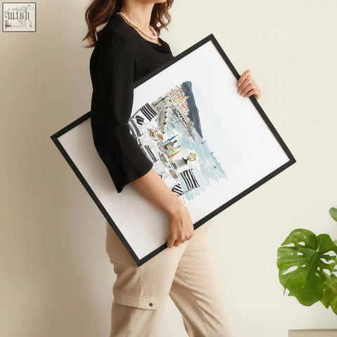 Black framed watercolor coastal town painting with striped buildings and boats wall art set of three prints for dining room