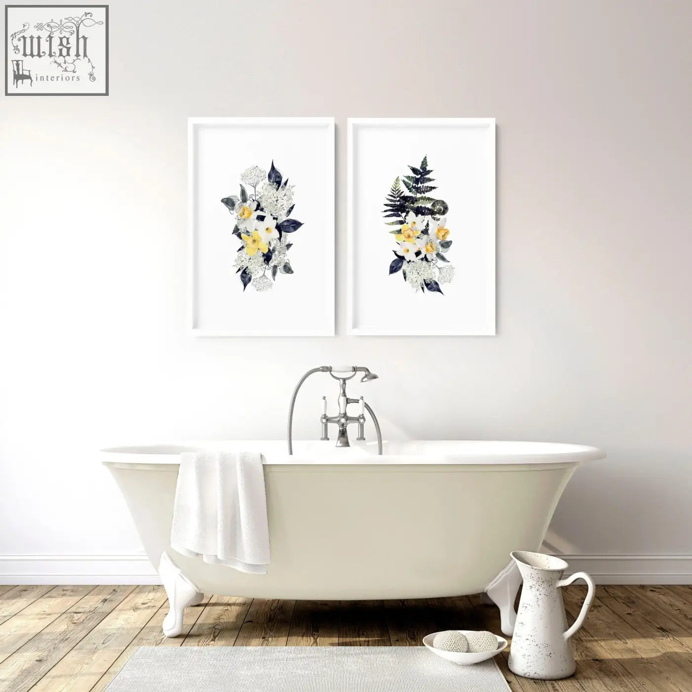 White clawfoot bathtub with silver faucet and towel beside set of 2 floral wall art prints for bathroom walls