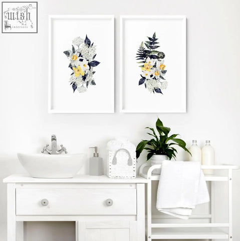 White framed wall art prints with yellow white and dark green watercolor flowers perfect for bathroom walls set of 2