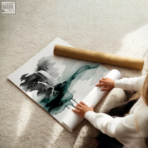 A large wall art japanese ink landscape with bold black and teal brushstrokes partially unrolled by a brown tube