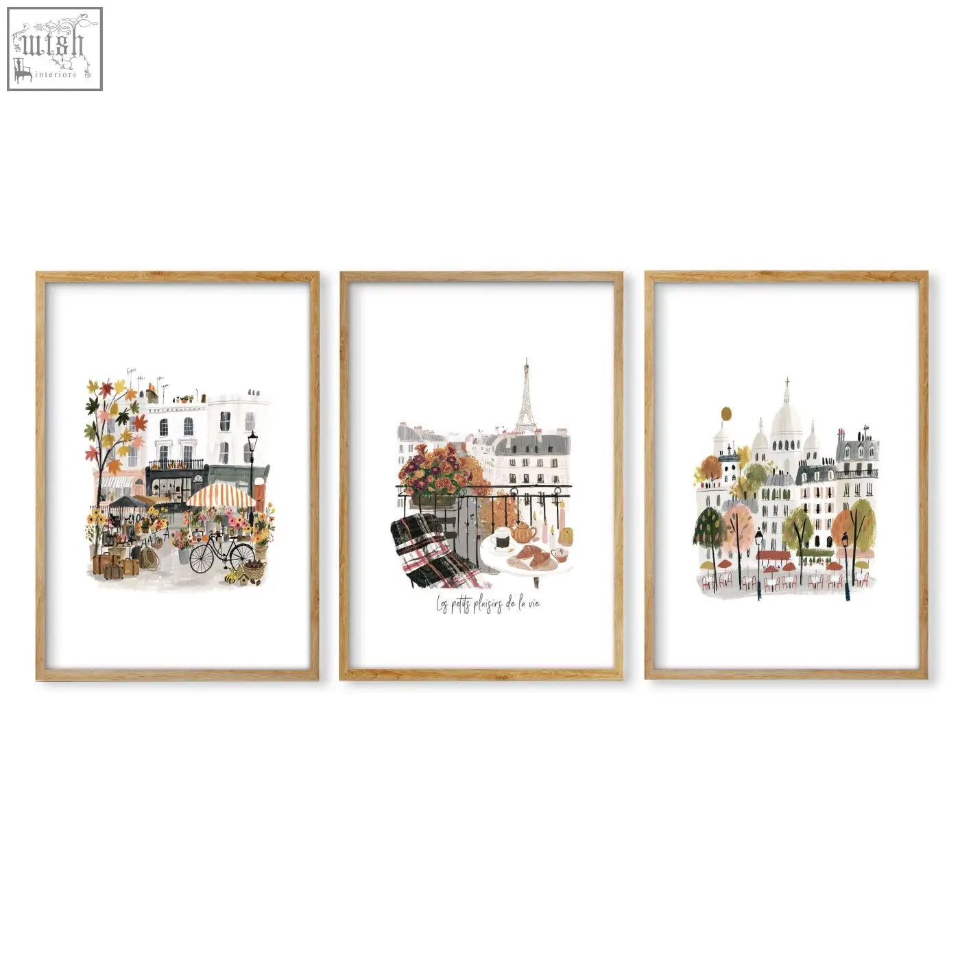 Set of three framed parisian-themed watercolor wall art prints in light wood frames perfect for living room decor