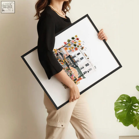 Black-framed wall art living room print featuring colorful illustrated paris street scene with autumn leaves and buildings