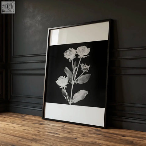 Black-framed wall art nature charcoal botanical floral print with delicate monochrome flowers on black background