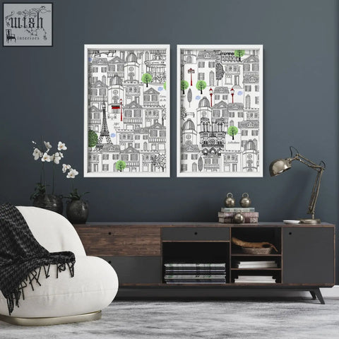 Two framed wall art paris travel posters with black and white cityscape sketches and green accents on a plain background