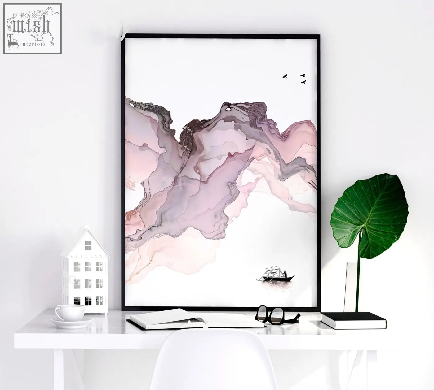 A set of 3 framed seaside wall art prints featuring soft pink purple gray marbled mountain forms with a small black boat
