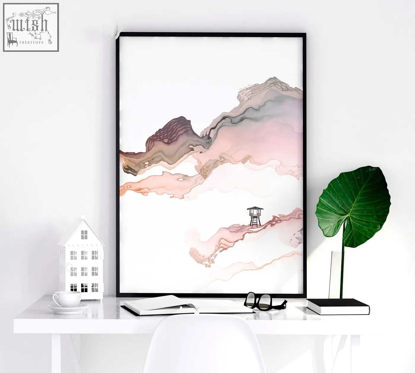 Minimalist black-framed seaside wall art with abstract pink and brown watercolor mountains and a wooden lifeguard tower