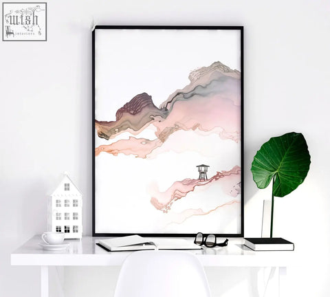 Minimalist black-framed seaside wall art with abstract pink and brown watercolor mountains and a wooden lifeguard tower