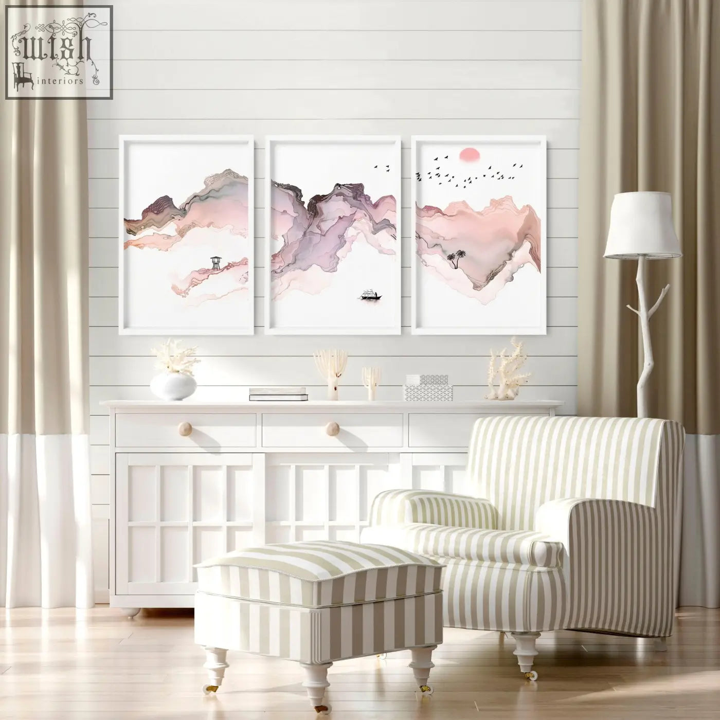Striped armchair with beige and white vertical stripes and ornate legs next to a set of 3 framed seaside wall art prints