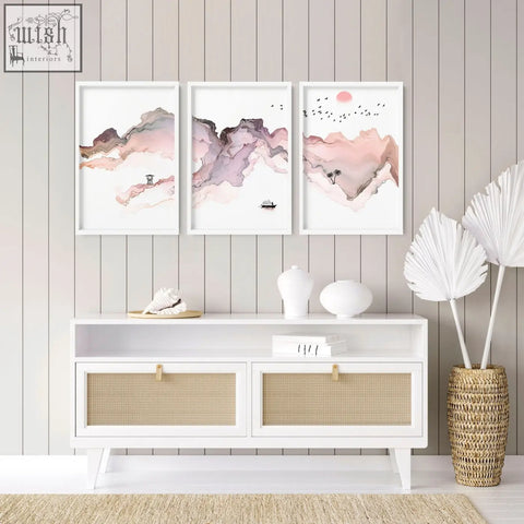 Set of three framed abstract watercolor mountain wall art prints in soft pink mauve and beige perfect for seaside wall decor