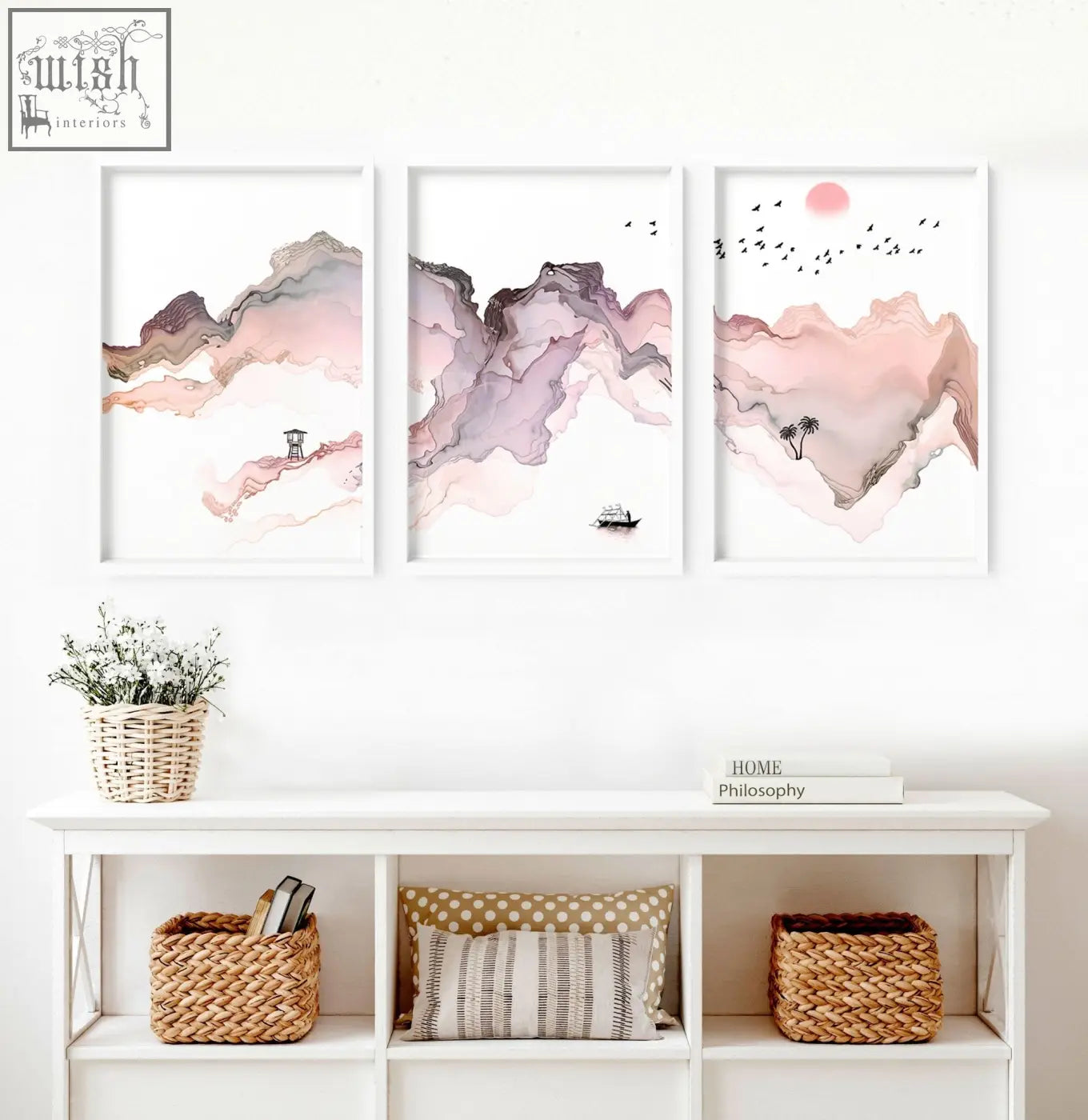 Three framed seaside wall art prints featuring watercolor mountain landscapes in soft pink mauve and gray hues in white frames