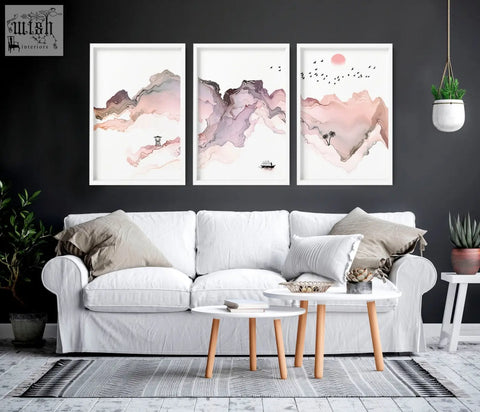 White framed seaside wall art triptych featuring soft pink and purple watercolor mountain landscapes with ink details