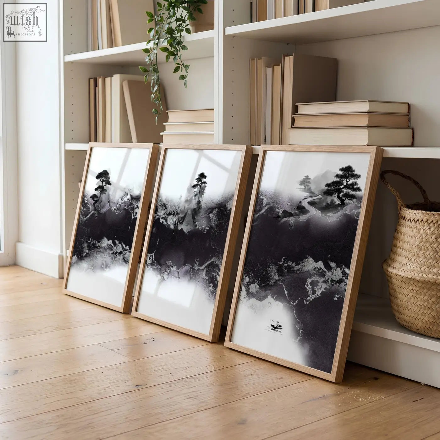 Three framed black and white ink wash landscape prints in minimalist wooden frames for high ceiling living room wall decor