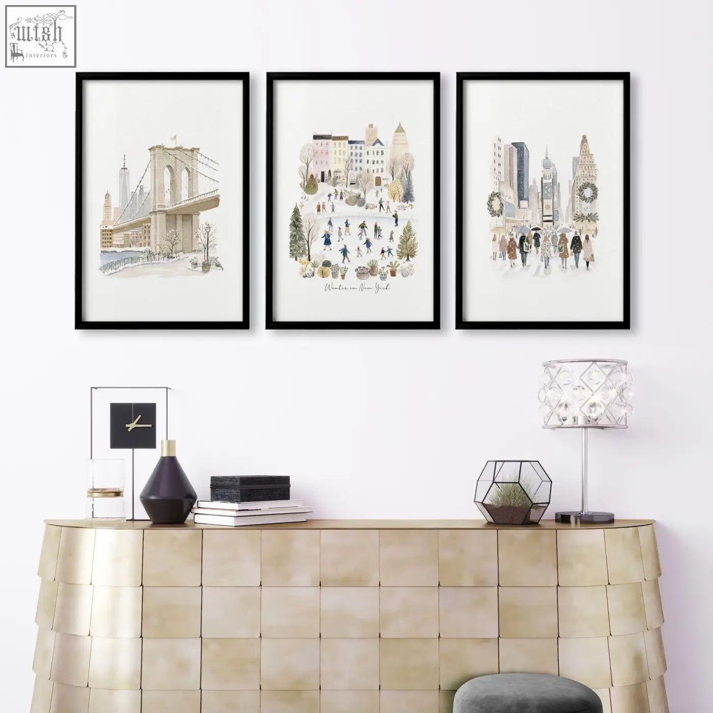 Three black-framed beige pastel nyc travel art prints above a gold console table for living room wall decor ideas