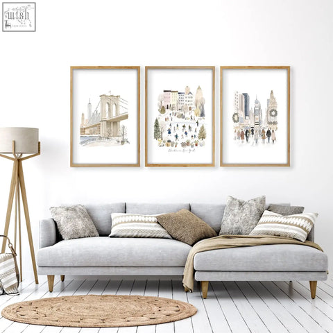 Three framed watercolor new york city prints in beige pastel tones with light wood frames perfect for living room wall decor