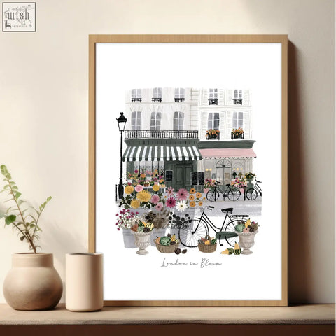 A framed london in bloom print with parisian street flowers and bikes perfect for living room wall decoration living