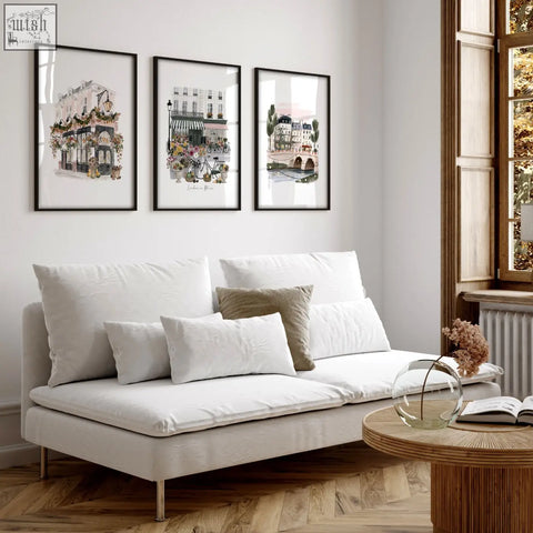 White upholstered sofa with metallic legs and cushions next to london in bloom british travel wall decoration living room set
