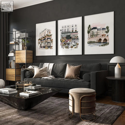Dark gray velvet sofa with beige and white throw pillows below london in bloom british travel wall decoration living room prints set of 3