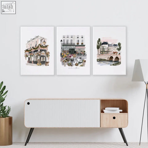Set of three framed watercolor prints with pastel parisian street scenes and floral details perfect for decoration living room