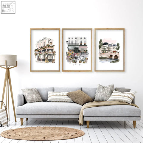 Three framed london in bloom watercolor prints hang above a gray sectional sofa for decoration living room wall decoration living